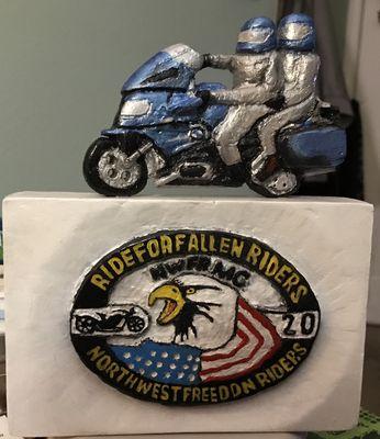 Carving of a BMW and Ride For Fallen Riders emblem.