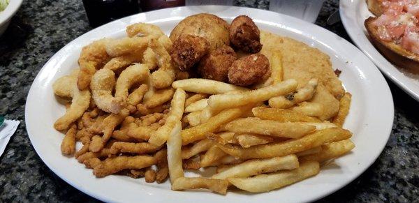 Fried seafood dinner. Clams, scallops, fish, crabcake, shrimp.