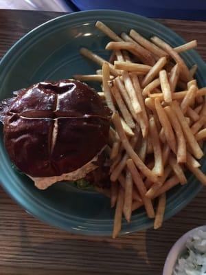 Breakfast burger on pretzel bun and fries