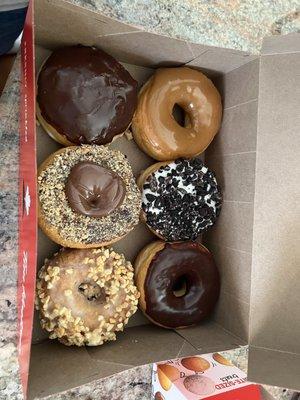 Maple dipped , Oreo, chocolate dipped, Boston cream, Nutella and peanut crunch