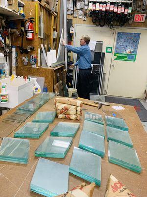 Jeramie working in our service center. He is filling a glass order.