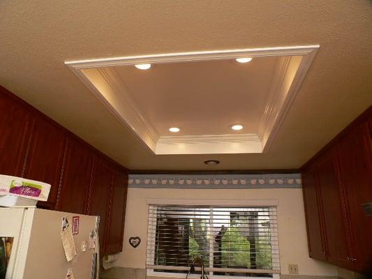 "What do I do with my old wood-frame box-light in my kitchen?" Take it out and let us replace it with modern recessed lights!