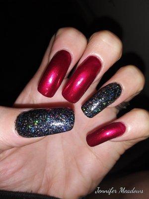 Got my nails done at Yenee nails and I love them ruby red with holographic black glitter