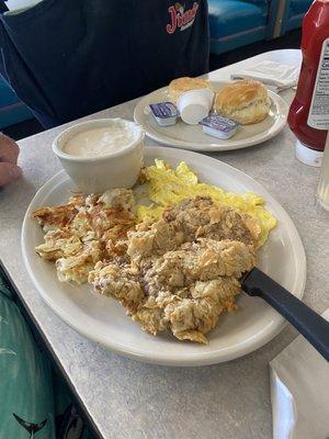 Chicken Fried Chicken Breakfast with scrambled eggs and biscuits