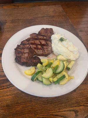 Ribeye Steak with house made mash potatoes and seasoned vegetable medley.