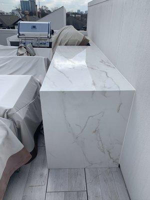 Out door kitchen , water fall porcelain slab