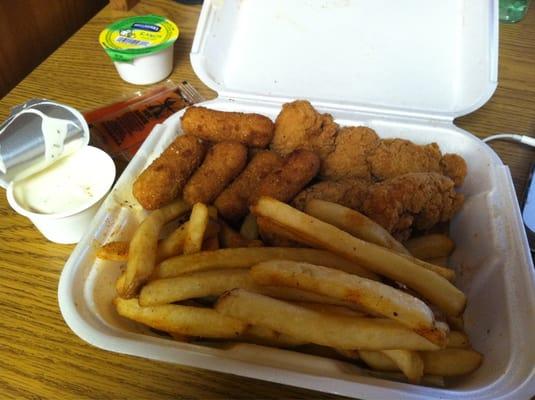 Chicken strip plate with seasoned fries and hushpuppies.