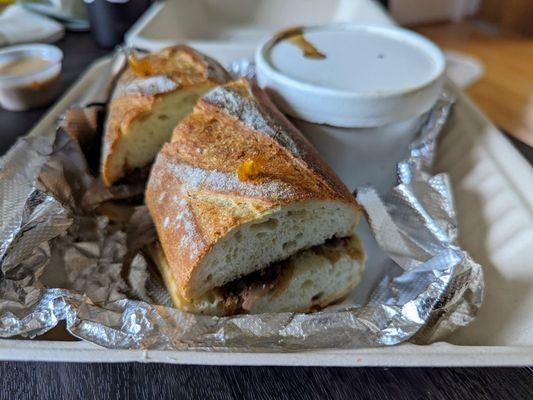 French dip sandwich. Sando is decent but the au jus is wayyyyyyy too salty.