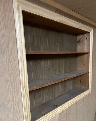 Old paneling behind and wood shelves as well as the framing.