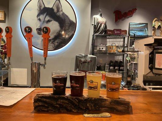 Flight in the taproom.   Nice log/wilderness style flight board.