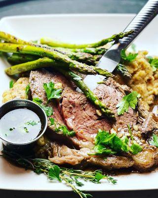 Horseradish Crusted Prime Ribeye  With Truffle Mashed Potatoes and grilled Asparagus.