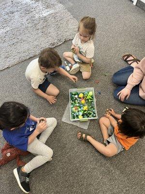 Sensory bin fun during language group