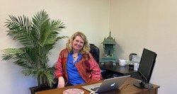 Michelle at her desk in Pleasant Hill