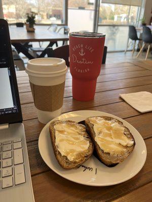 Fresh coffee and cream cheese w/honey on fresh sourdough.