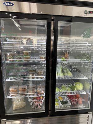 Refrigerator case with prepared Filipino food and Asian vegetables