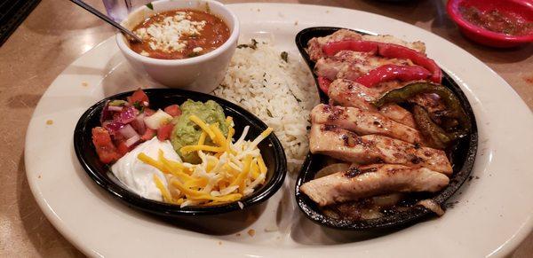 Grilled chicken fajitas served with soft tortillas. Delicious! Rice had a great buttery flavor.