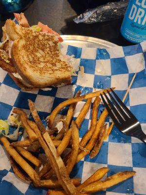 The food was so good I ate half before I remembered to take a picture. Club sandwich and fries.