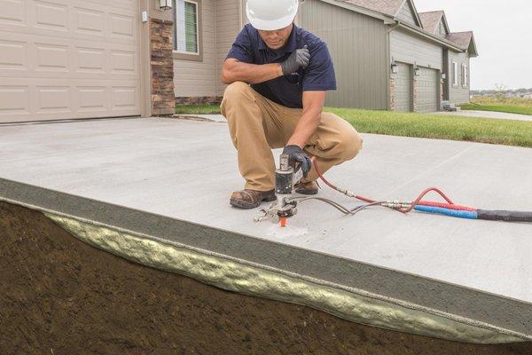 Concrete slabs lifting with foam jacking.