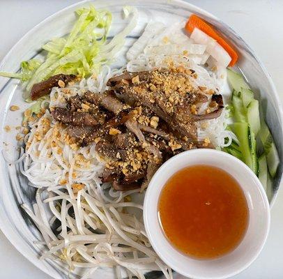 Grilled pork rice vermicelli accompanied by fresh vegetables and homemade sauce with pickle ( V2 pork).