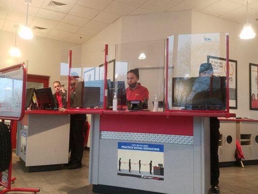 Not good compliance with wearing masks indoors. 4/4 employees shown here with them off or on chin.