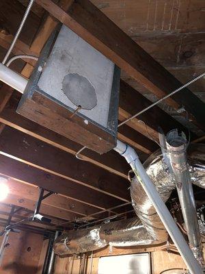 Trying to tape the duct to asbestos exhaust pipe with foil tape, duct falls to the floor in previous photo...SMH.