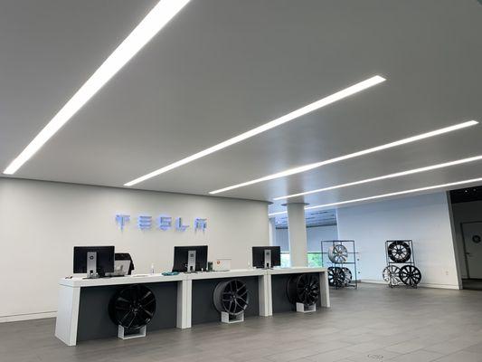 Clean showroom and assortment of Tesla wheels.