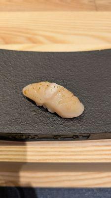 Hotate (scallop) - cured with dried konbu to enhance flavour. Yuzu on top.