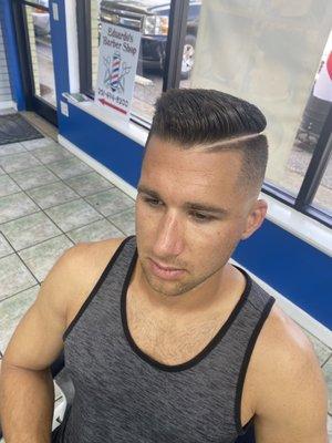 Skin fade with a hard part