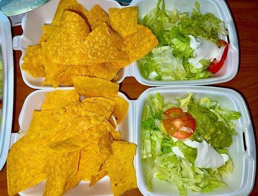 Tortilla Chips and side of: lettuce, guacamole and sour cream