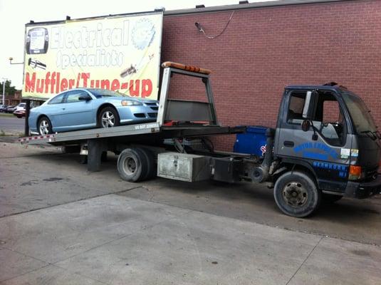 A CUSTOMER CAR BEING TOWED IN BY OUR TOWING  TEAM