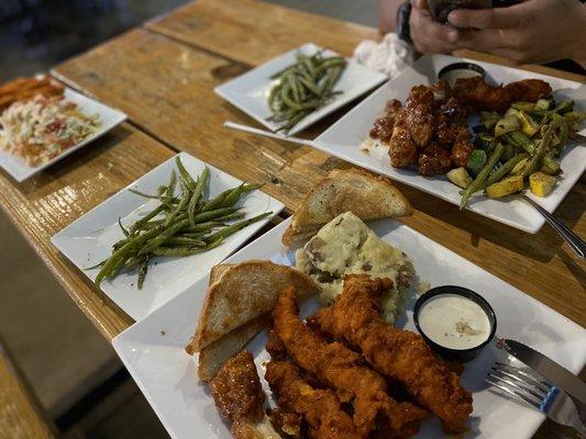 Chicken Tenders tossed in spicy buffalo and another tossed in Jamaican jerk