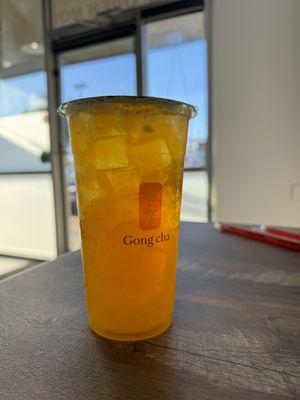 Peach Green Tea with mango popping boba