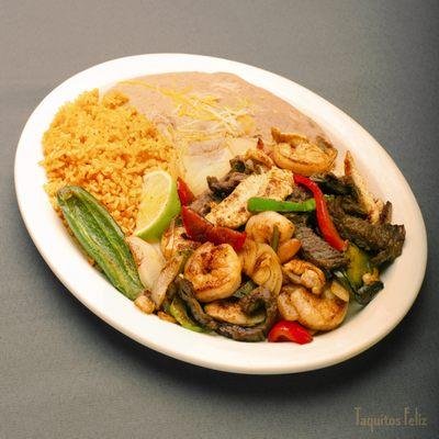 Triple Fajitas - Asada, Shrimp and Chicken with side of rice and beans and your choice of flour or corn tortillas.