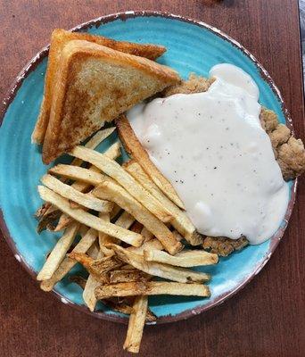 Small chicken fried steak with buttery Texas toast and hand cut fries.