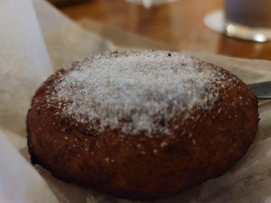 Dessert: Close-up of Empanada de Platano (ripe plantain shell turnover, rice pudding filling, sprinkled with sugar) 1.29.22