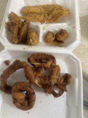 Onion rings, fish, chicken, and hush puppies.