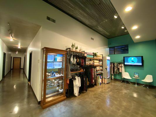 Lobby and retail area with beverages, clothing, props, jewelry, sound instruments