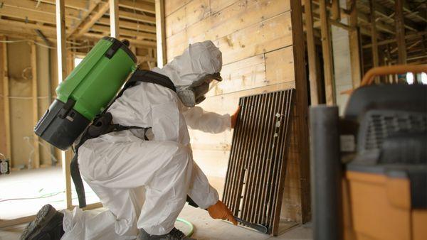 SERVPRO technician cleaning soot after a fire.