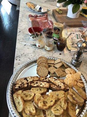 Bleu, brie and gouda cheeses, parmesan cheese crisps, almondina crackers and salami.