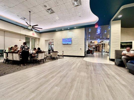 Dining area with a weird awkward space between the tables and booths.