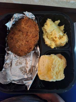 A salmon patty (as in one) scrambled eggs and homemade biscuit