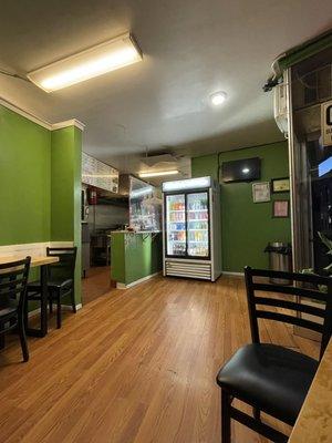 Dining area. Fridge with drink options.