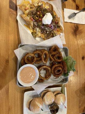 Nachos, onion rings and sliders.