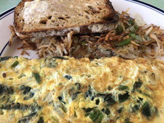 DIY Omelette-- this is spinach, onion, Swiss. Hash browns with onion and pepper. A slice of homemade sourdough. Yum!