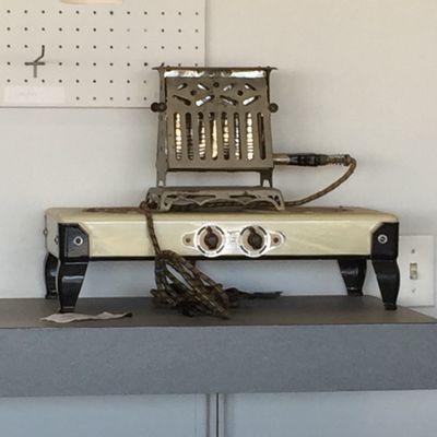 Vintage toaster and hot plate for atmosphere. Or maybe snacks, I'm not entirely sure.