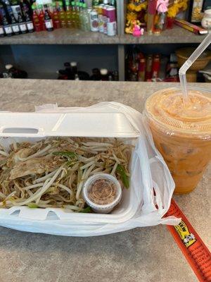 Chicken pad Thai with spicy sauce and a Thai iced tea