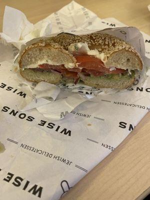 Sesame Bagel, Scallion cream cheese, smashed avocado, tomato & Onion.