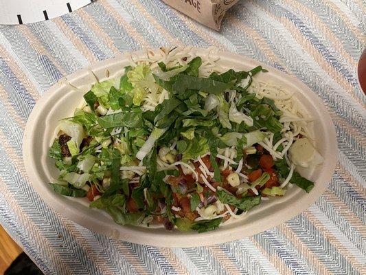 Chicken bowl with brown rice, black beans, roasted chili corn salsa, fresh tomato salsa, cheese and lettuce.