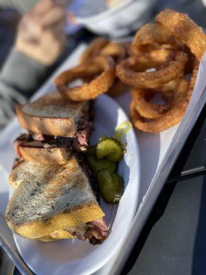 Pastrami sandwich and delish onion rings