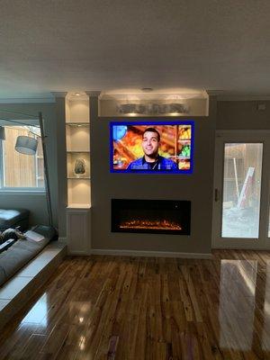 Installed Floating Fireplace and TV with Lighted Shelving